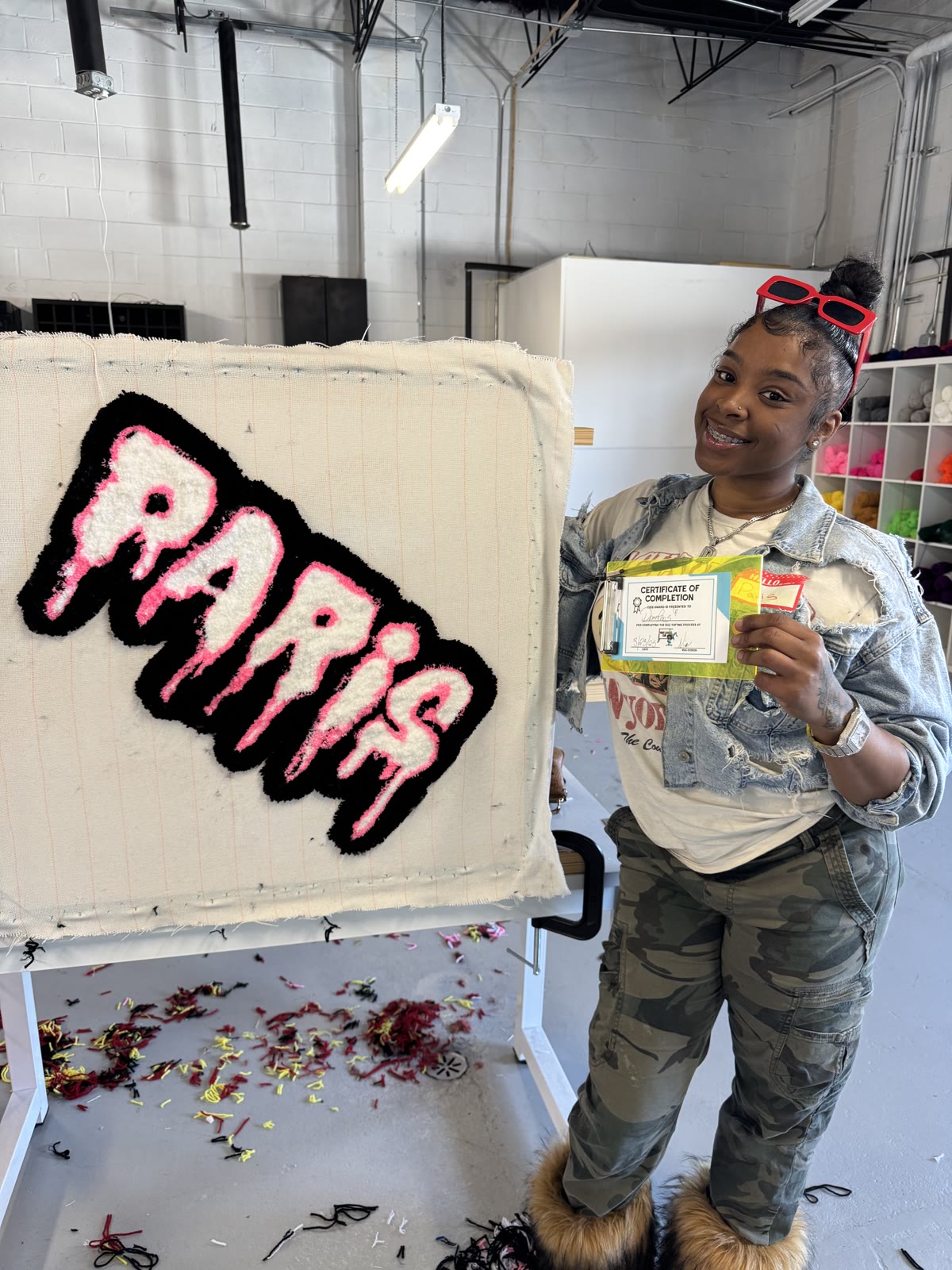 Workshop customer with finished 'PARIS' tufted piece
